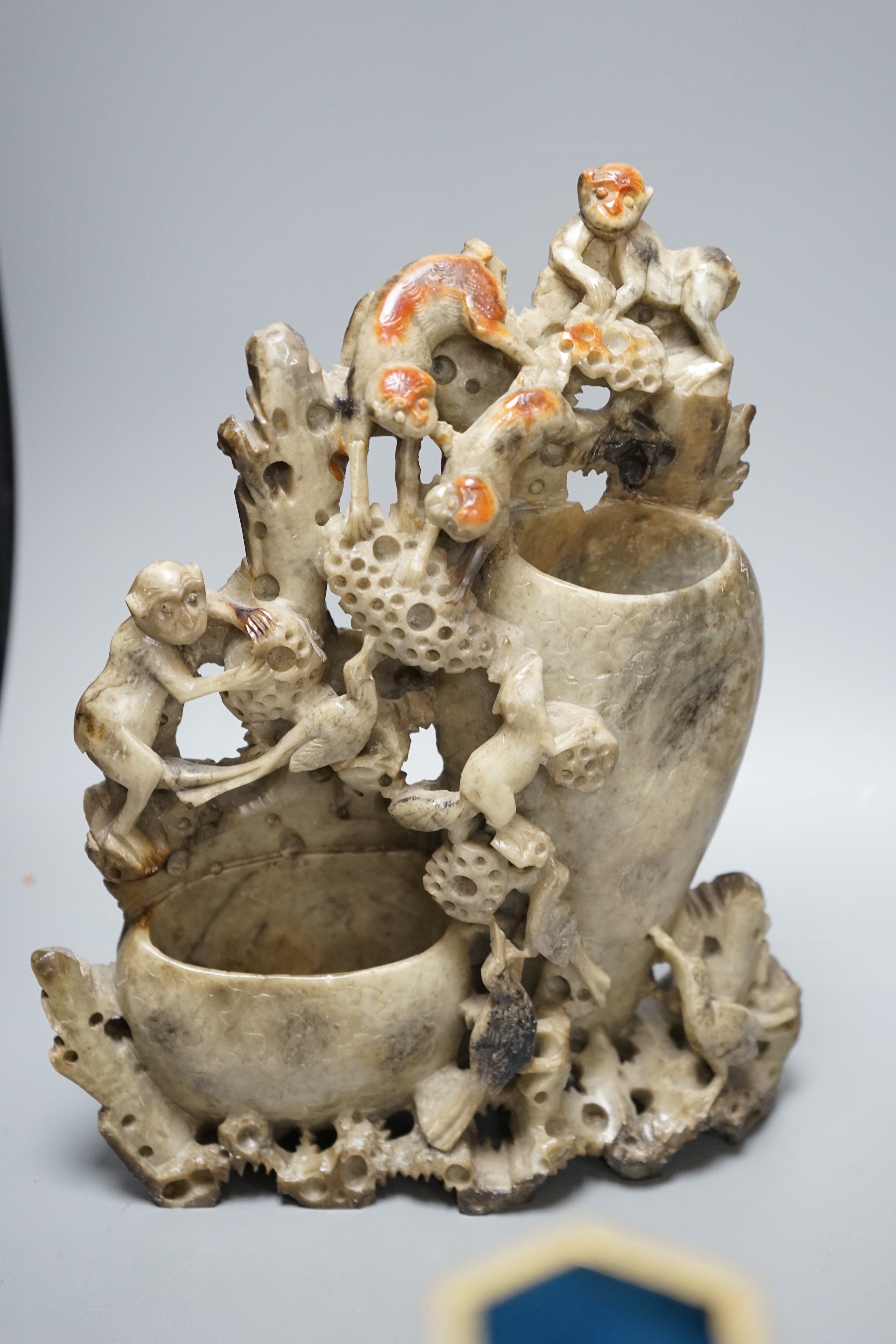 Two Chinese champlevé enamel vases, a soapstone carving and three early 20th century Chinese carved hardwood figures, tallest 26cm